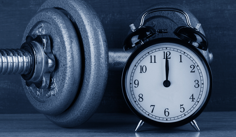 dumbells with clock pointing to Noon